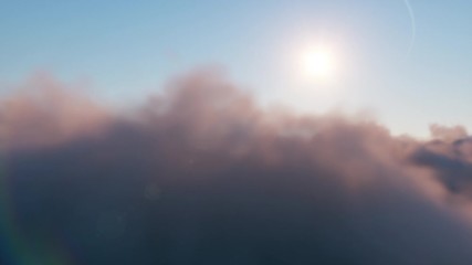 Wall Mural - flight through moving cloudscape with beautiful sun rays. beautiful realistic flight over cumulus lu