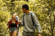 © BalanceFormCreative - Group of friends hiking in nature.Young black man lead the group.