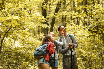 Wall Mural - portrait of young hikers in nature.they look around and joying in nature.
