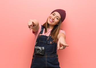 Wall Mural - Young cute photographer woman cheerful and smiling pointing to front