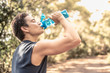 © kieferpix - Fit sporty male drinking from bottle of water.