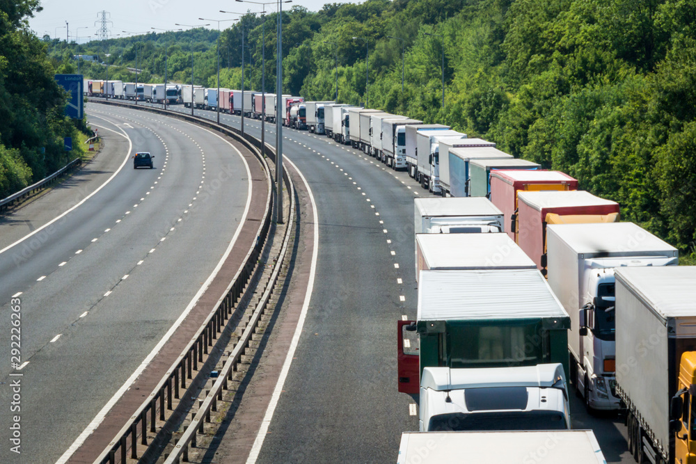 A Line of Lorries Parked on the M20 Motorway in Operation Stack - obrazy, fototapety, plakaty 