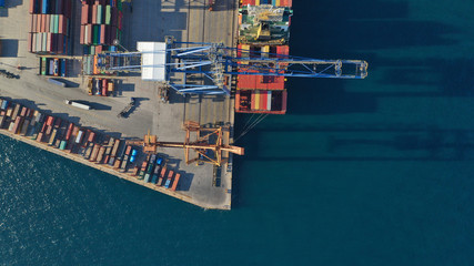 Aerial top down photo of containers in ship port for business Logistics and transportation of Container Cargo, logistic import export and transport