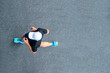 © Augustas Cetkauskas - Man sprinting in the morning outdoors. Top view of male runner working out in the city.