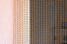Abstract Background Thread Curtain For The Doorway Next To Textured Concrete Wall