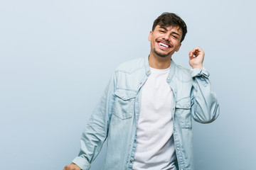 Wall Mural - Young hispanic cool man dancing and having fun.