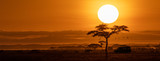 Fototapeta Zachód słońca - Orange Sunset Safari Vehicle Horizontal Web Banner
