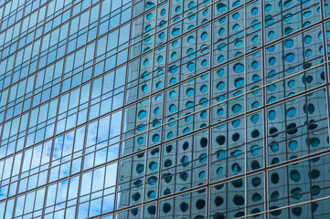 Panoramic and perspective wide angle view to steel blue background of glass high rise building skyscrapers in modern futuristic downtown