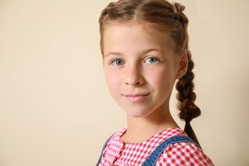 Cute little girl on light background