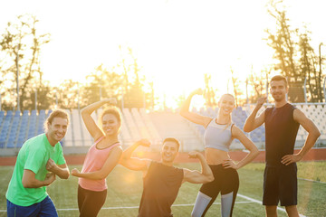 Sticker - Group of sporty young people at the stadium