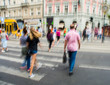 © vbaleha - Busy city street people on zebra crossing. Intentional motion blur