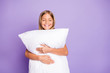 © deagreez - Portrait of positive cheerful kid enjoy bed time hug embrace her pillow have weekends nap feel sleepy daydreaming isolated over violet purple color background