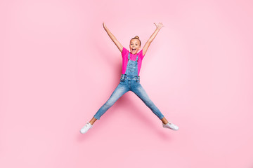 Wall Mural - Full length body size photo of cheerful cute stylish trendy top-knot nice shouting girl shaping star with her body wearing jeans t-shirt rejoicing overjoyed isolated over pink pastel color background