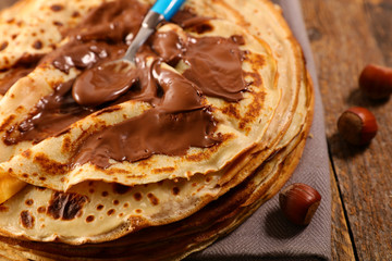 Canvas Print - delicious crepe with creamy chocolate and spoon