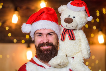 Kindness and generosity. Charity help. Spread joy happiness. Celebrate new year. Winter fundraising ideas. Charity concept. Man bearded Santa claus play with soft toy teddy bear. Christmas charity