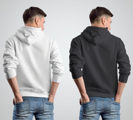 Sticker - Template mockup white and black hoodies on a young guy, rear view.