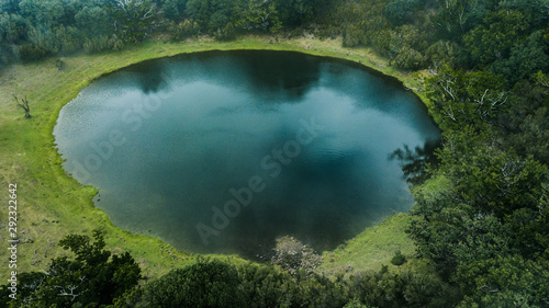 Cuadros en Lienzo Aerial view of natural pond surrounded by pine trees in Fanal, Madeira island, P