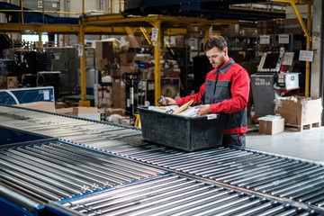 Warehouse worker working on a conveyor line