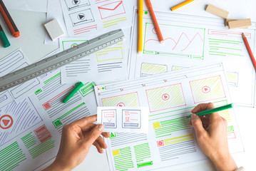 Wall Mural - the designer creates sketches of web sites.