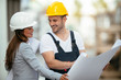 © JustLife - Architect and worker discussing project