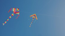 Two Kites Soar Nearby High In The Sky. Synchronization And Precise Control Concept