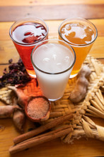 Set Of Mexican Fresh Water Also Called "aguas Frescas". Hibiscus, Tamarind And Horchata On Wooden Background