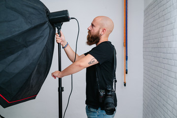 Wall Mural - an photographer with camera in studio