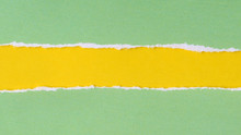 Green Ripped Paper On Yellow Background