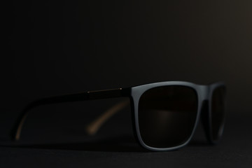 dark sunglasses on black background