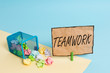 Handwriting text writing Teamwork. Conceptual photo Group of showing who work together as one and with the same aim Trash bin crumpled paper clothespin empty reminder office supplies tipped