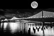 San Francisco-Oakland Bay bridge Illuminated at night with full moon