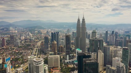 flight over kuala lumpur city sunny day downtown aerial panorama 4k timelapse malaysia