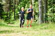 © Kadmy - man and woman jogging and running outdoors in forest