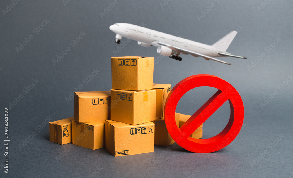 Cargo plane, many boxes and red prohibition symbol NO. Embargo trade wars. Restriction on importation, ban transit export dual-use goods to countries under sanctions. transport companies. - obrazy, fototapety, plakaty 