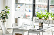 © LIGHTFIELD STUDIOS - office with table, chairs, green plants and digital devices