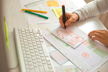 Wall Mural - website designer creates a sketch application. developing a project drawing an interface mockup.