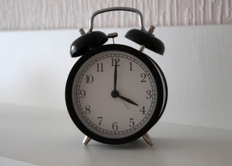 black and white clock on the table