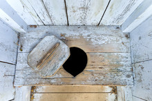 Interior Of An Old Wooden Outhouse