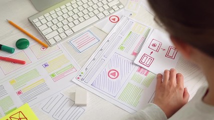 Wall Mural - the designer draws sketches of the website. layout development. creating a project application inter