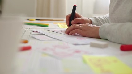 Wall Mural - the designer draws sketches of the website. layout development. creating a project application inter