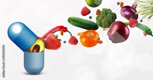Vitamins pill with flying fruits on white background
