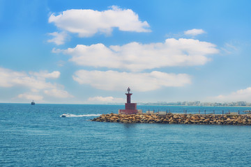 Wall Mural - Ships near the entrance to the port. The breakwater and cloudy sky - Tunisia, Sousse, El Kantaoui 06 19 2019