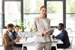 © LIGHTFIELD STUDIOS - smiling beautiful businesswoman holding digital tablet in office