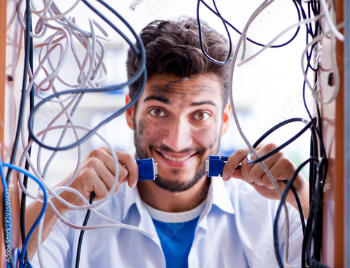 Fotografía Electrician trying to untangle wires in repair concept