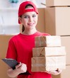 © Elnur - Young woman working in parcel distribution center