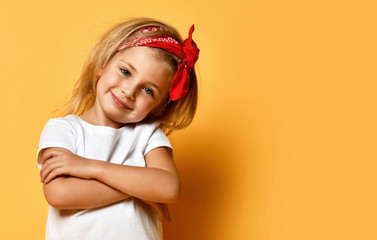 Wall Mural - Little baby girl in white blank white t-shirt design red head band happy smiling on yellow 