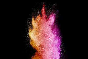 Explosion of colored powder isolated on black background. Abstract colored background. holi festival.