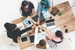 © InfiniteFlow - Businessmen and businesswomen joining hands in group meeting at multicultural office room showing teamwork, support and unity in business. Diversity workplace and corporate people working concept.
