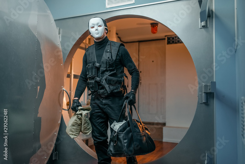 Fotomural Bank robbery, robber in black uniform and mask