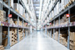 Warehouse inventory with packing box storage in factory. Logistic transportation storehouse concept. in blurred background.